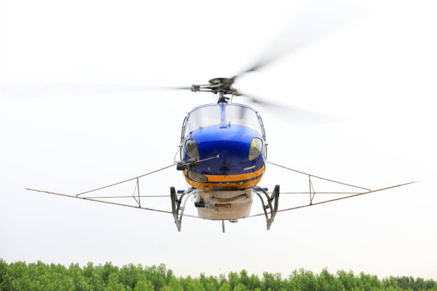 istock Agricultural helicopters fly in the sky 1874502628