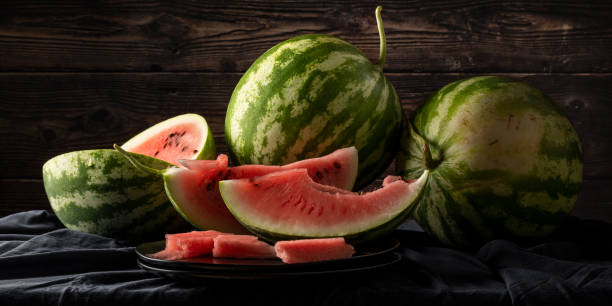 Fresh raw watermelons on the table, healthy eating themes