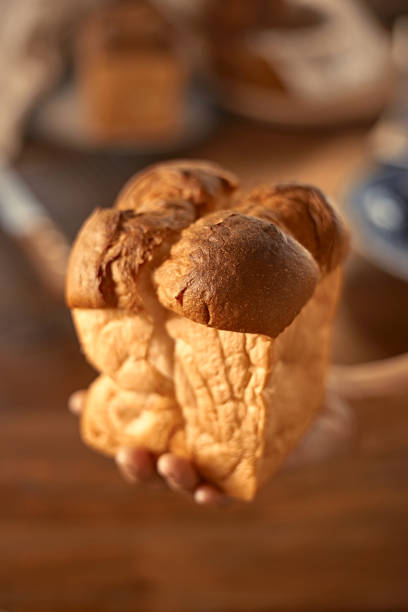 istock Female hands holding homemade fresh bread 1874504144