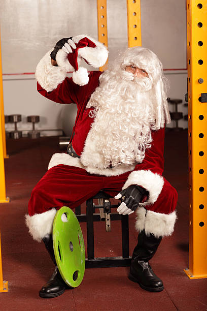 istock Tired Santa Claus- break in training before Christmas 187451613