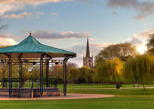 Bandstand and church at Stratford upon Avon, Warwickshire, England.