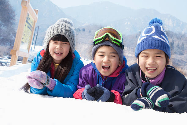 istock Children Lying on the Snow 187451739