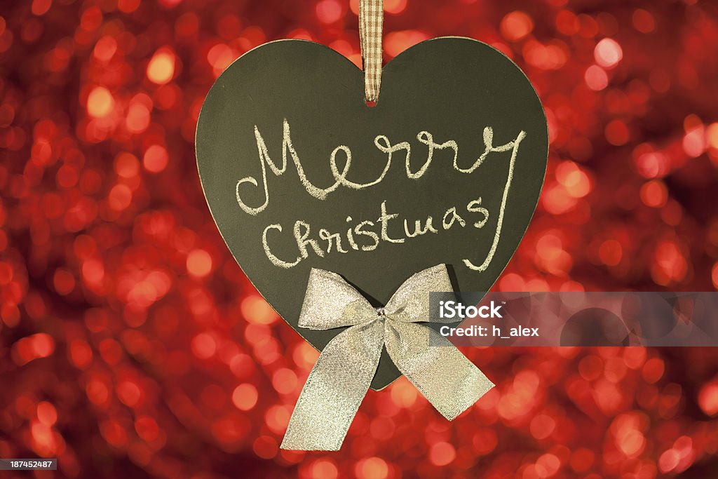 Christmas card with heart blackboard Christmas card with heart blackboard on red background Abstract Stock Photo