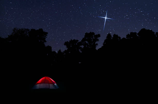 istock Night sky over North Carolina with bright star and red tent 1874533200