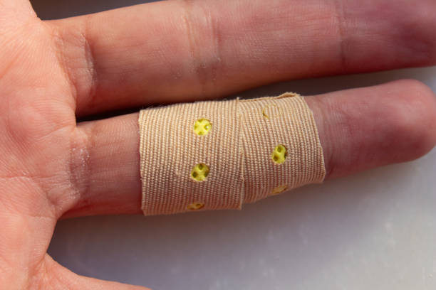istock Adhesive medical plaster on hand 1874539011