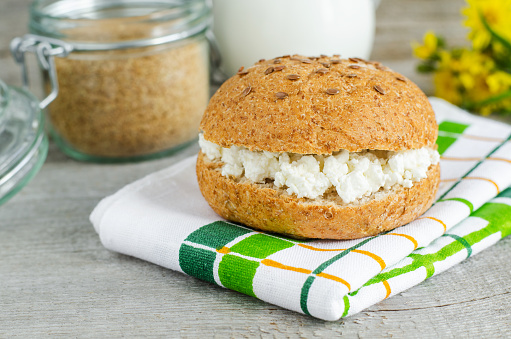 Hamburger bran bun with crumbly farmer's cheese filling. Vegeterian burger.