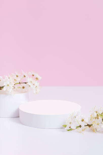 istock Empty podium or pedestal with spring bloom. Mock up for cosmetic products 1874551194