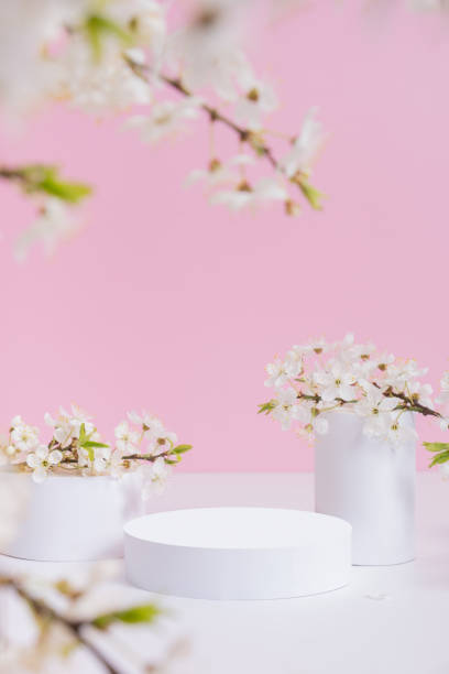 istock Empty podium or pedestal with spring bloom. Mock up for cosmetic products 1874551196