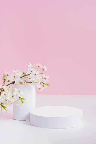 istock Empty podium or pedestal with spring bloom. Mock up for cosmetic products 1874551203