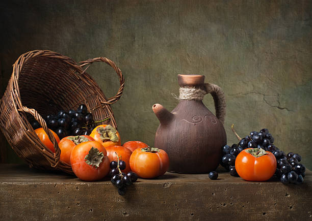 istock Still life with persimmons and grapes 187455661