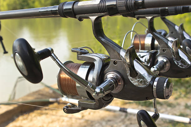 istock Fishing rod and reel under water 187456035