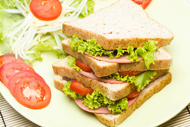istock sandwich with ham and tomato on plate 187456111