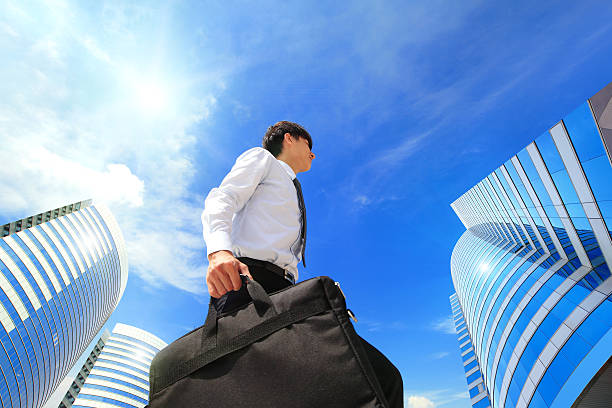 istock successful business man outdoors Next to Office Building 187456395