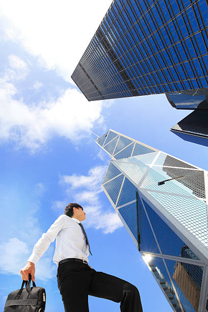 istock successful business man outdoors Next to Office Building 187456399