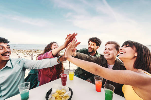 istock Diverse Friends Celebrating with High-Five Outdoors 1874565566