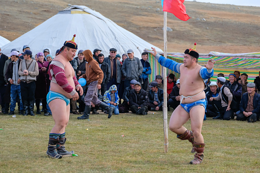 11th September 2023: A wrestler celebrating at a Mongolian wrestling competition in Bayan-Ölgii, the Kazakh region of western Mongolia, in the Altai Mountains. A traditional sport known as Bökh, a folk wrestling style of the Mongols, where touching the ground with anything other than the foot loses the match.