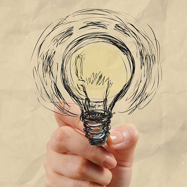 istock hand drawing light bulb with crumpled paper 187457144