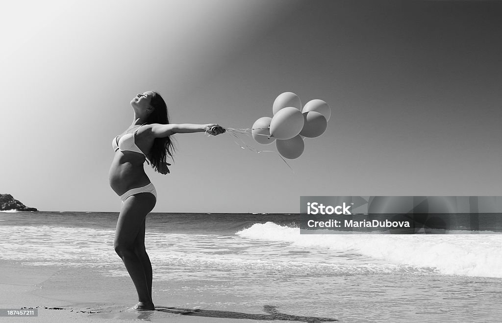 Beautiful girl with red balloon at blue sky background Love - Emotion Stock Photo