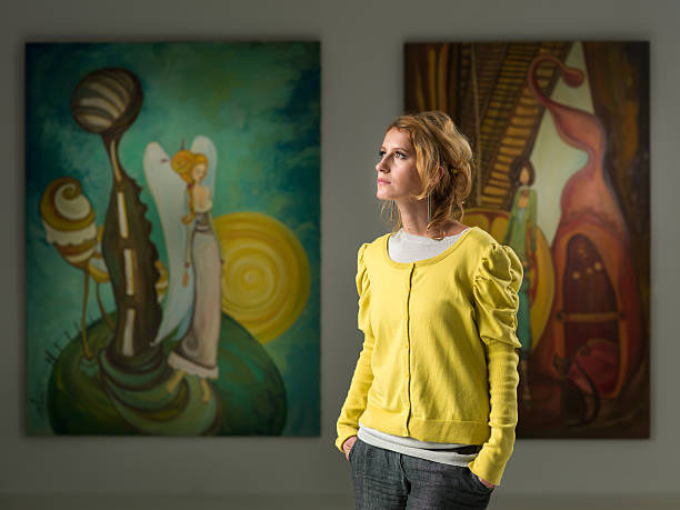 istock attractive young woman at art exhibition 187457244