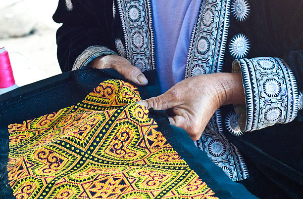 istock Hill tribe woman with hand embroidered on cloth 187457496