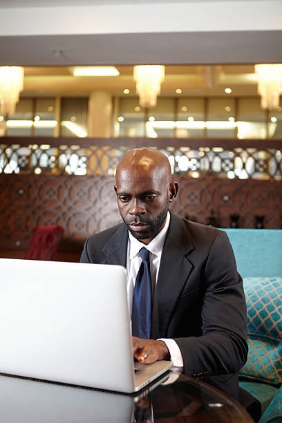 istock Black business man working late at his hotel 187457759