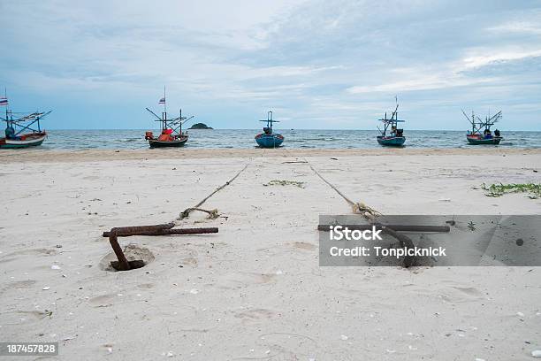Anchors On The Beach Stock Photo - Download Image Now - Anchor - Vessel Part, Symmetry, Anchor Chain