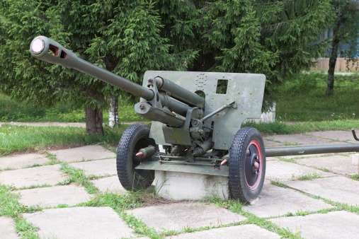 Artillery gun ZIS-3 in the square near the monument to fallen soldiers in World War II  The village Syamzha, Vologda region, Russia