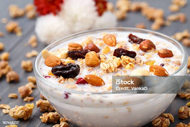 Healthy Muesli Breakfast With Huts And Raisin Stock Photo - Download Image Now - Almond, Berry Fruit, Bowl