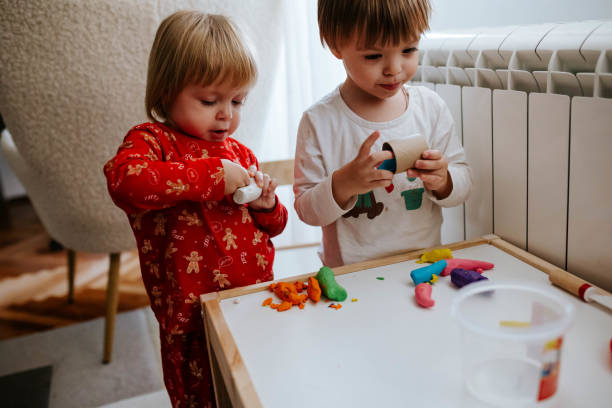 istock Kids are playing with plasticine 1874582352