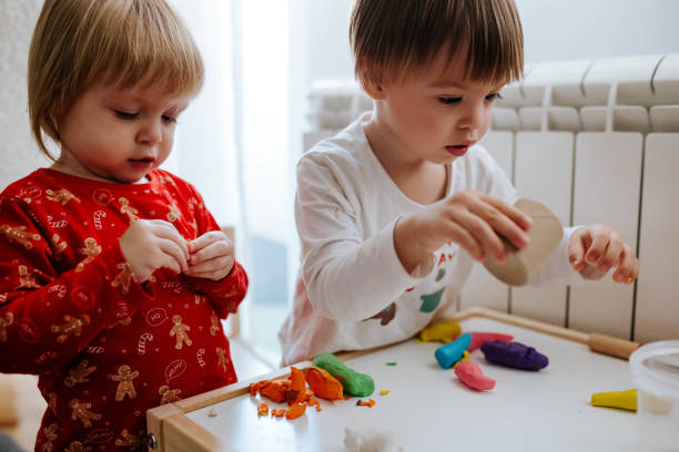 istock Kids are playing with plasticine 1874582366
