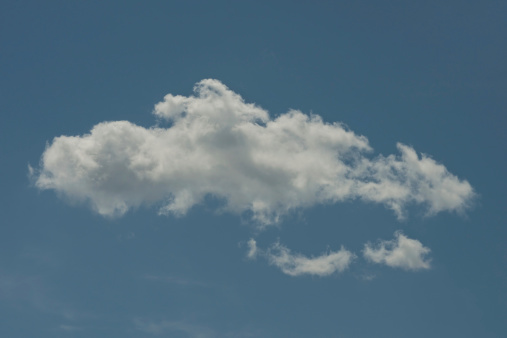 White puffy cloud formation over blue sky