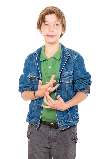 istock silly looking teenage boy makes gestures with his hands, isolate 187458746