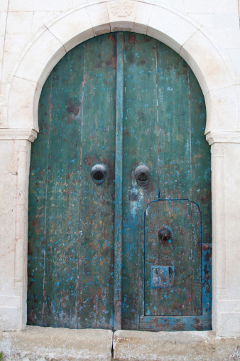 An old blue / green door in Tunisia.