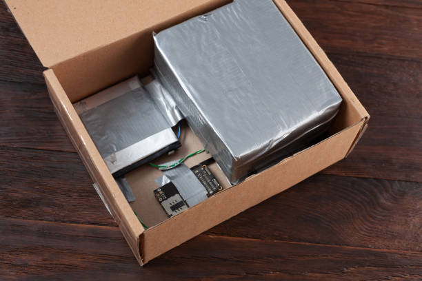 istock Hand made bomb with c4 and cell phone module in a cardboard box 1874609456