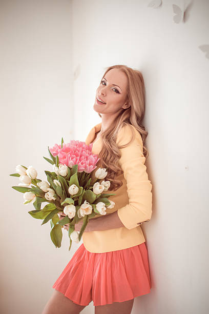 istock beautiful woman with tulips 187461309