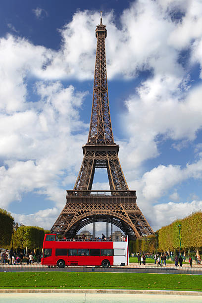 Paris, Eiffel tower with red bus in  France
