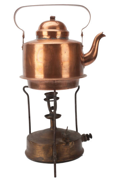 istock Retro vintage bronze primus stove with brass teapot. 1874617520