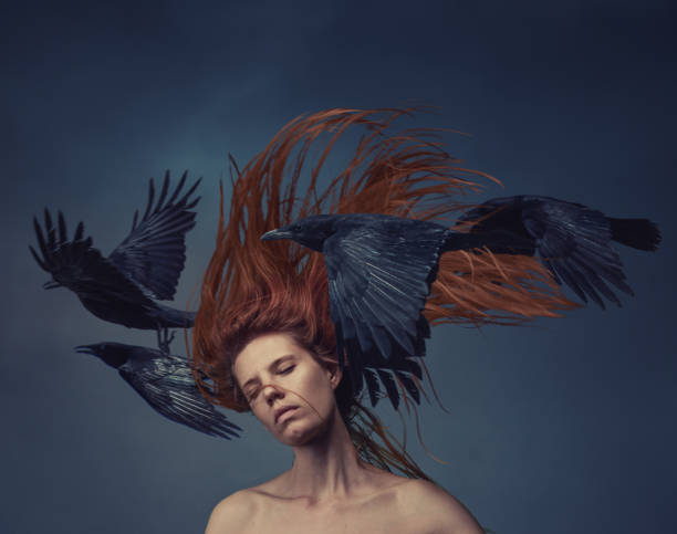 istock Young woman in motion with flying ravens 1874617528