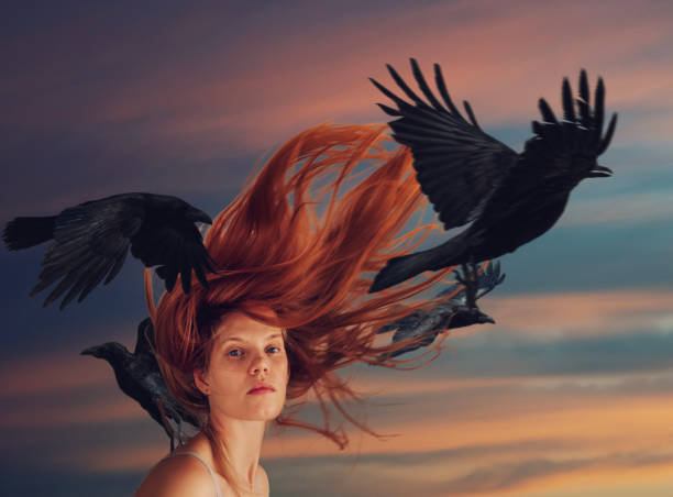 istock Young woman in motion with flying ravens 1874617529