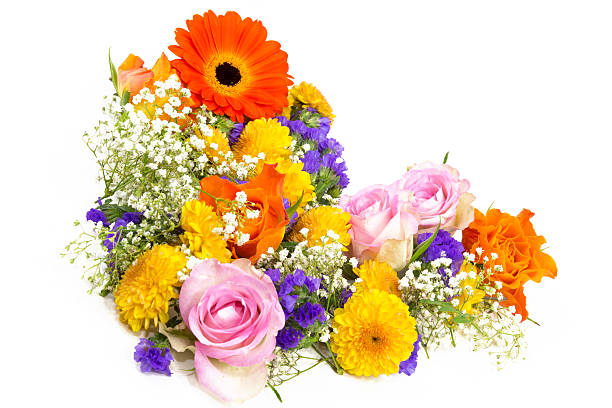 Floral decoration of roses, statics, veilwort, chrysanthemums, and marigolds as a heart