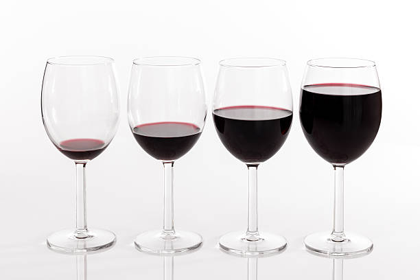 Glasses with different quantities of red wine stock photo