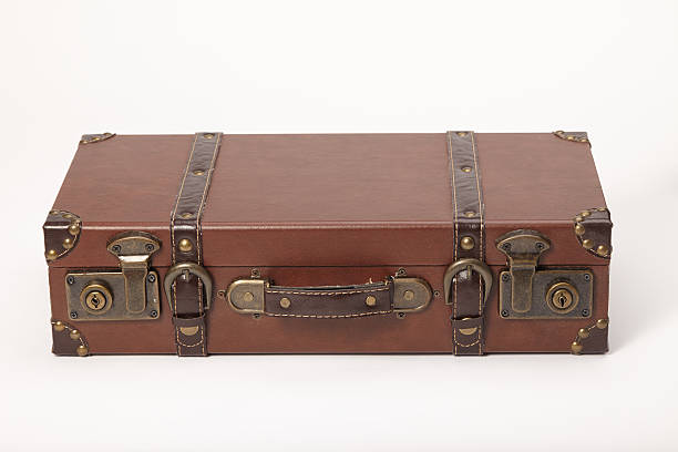 istock Old vintage leather suitcase lying down isolated on white 187461952