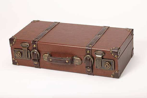 istock Old vintage leather suitcase lying down isolated on white 187461988