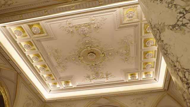 Unveiling majestic golden ornament decorative ceiling in villa ballroom