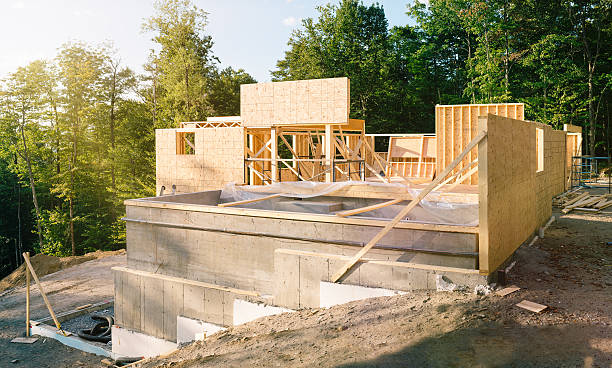 Residential construction site panorama with pool Residential construction site panorama with concrete pool in the foreground stability stock pictures, royalty-free photos & images