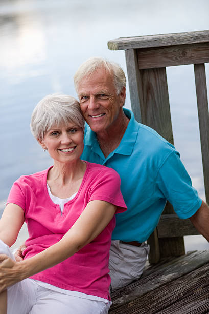 istock Smiling Senior Couple Relaxing On Deck 187462737