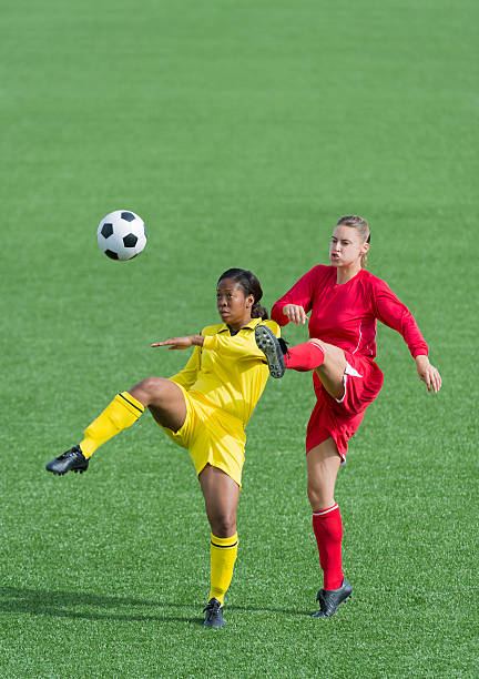 istock Young Women Playing Football 187463144