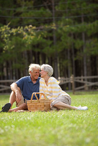 istock Cheerful Senior Couple Sitting In Park 187463253