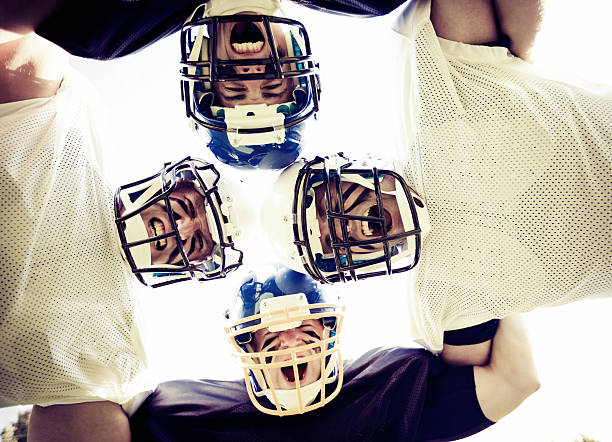 istock american football players posing 187463258