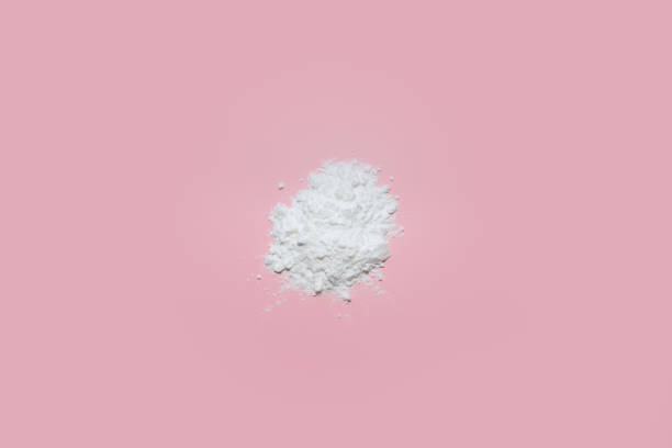 istock White face powder on pink background 1874656897
